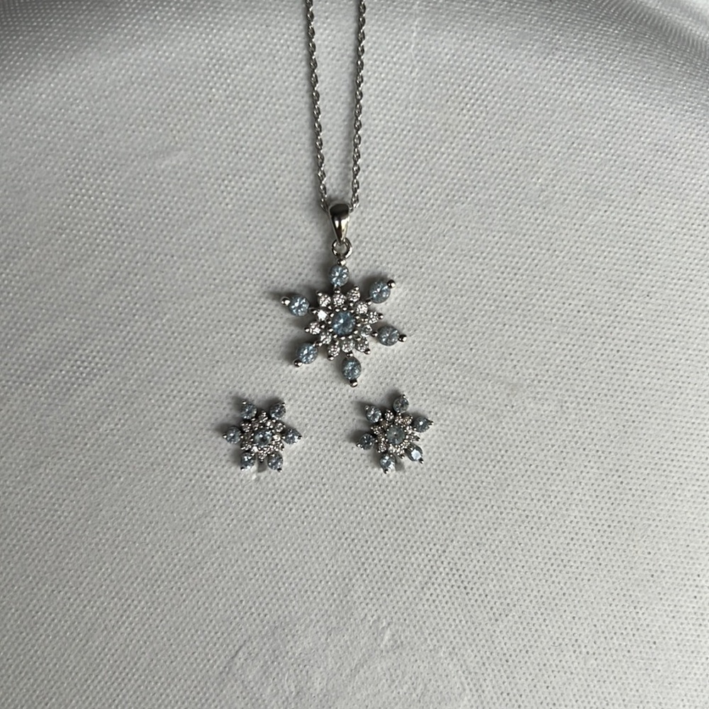 Blue snowflake necklace and earrings.